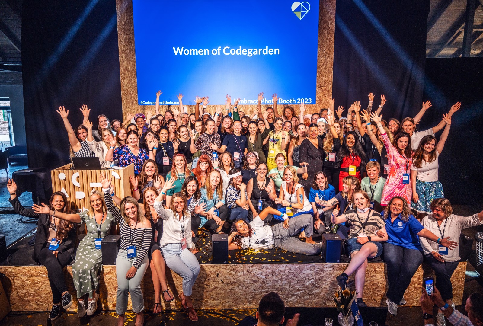 A photo of the umbraco codegarden main stage with all the women attendees smiling.